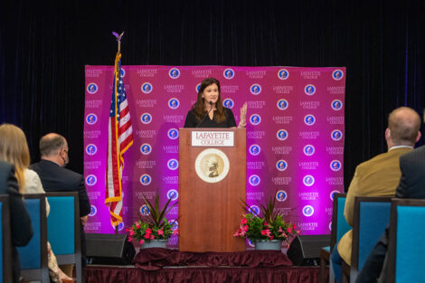 Nicole Hurd speaks at podium in Marlo Room