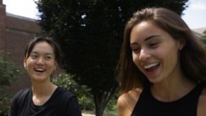Nina Beltrami '21 and a fellow female student laugh together.