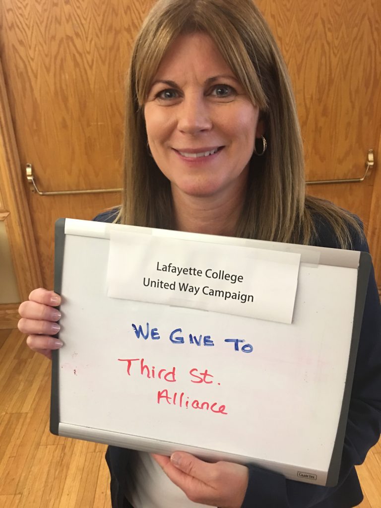 Jody Poniatowski holds a United Way sign.