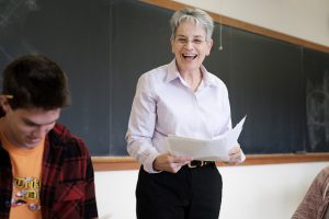 Rose Marie Bukics laughs in the classroom.